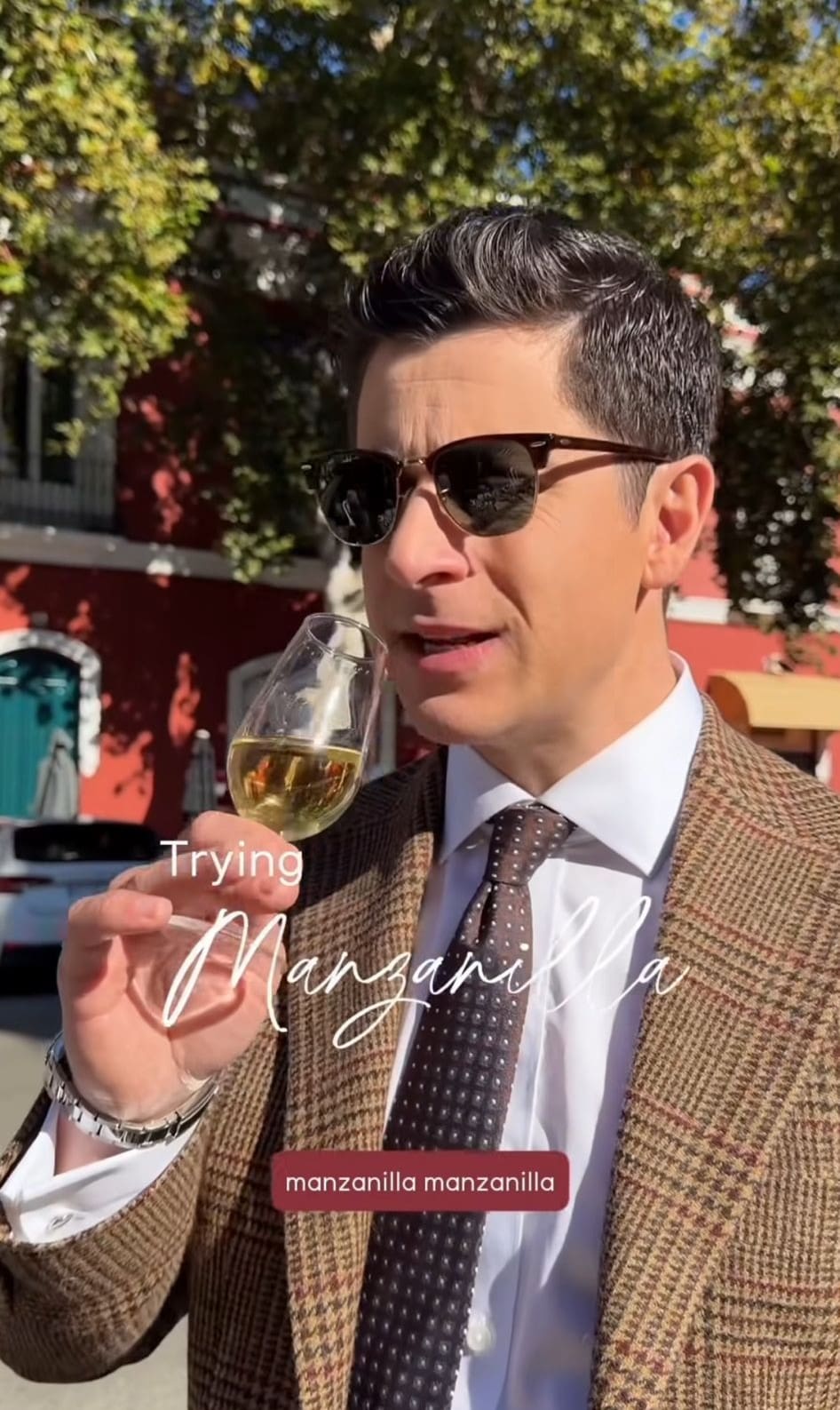 Actor David Henrie tasting a glass of manzanilla sherry on a sunny street during his visit to Spain