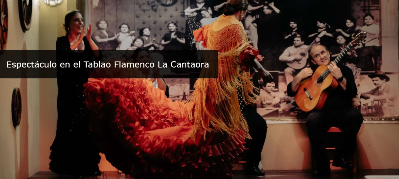 Flamenco dancer and guitarist performing at an intimate tablao in Seville