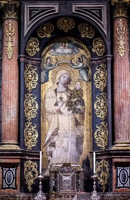 Gothic fresco of the Virgin of La Antigua holding the Child Jesus, crowned by angels in Seville Cathedral