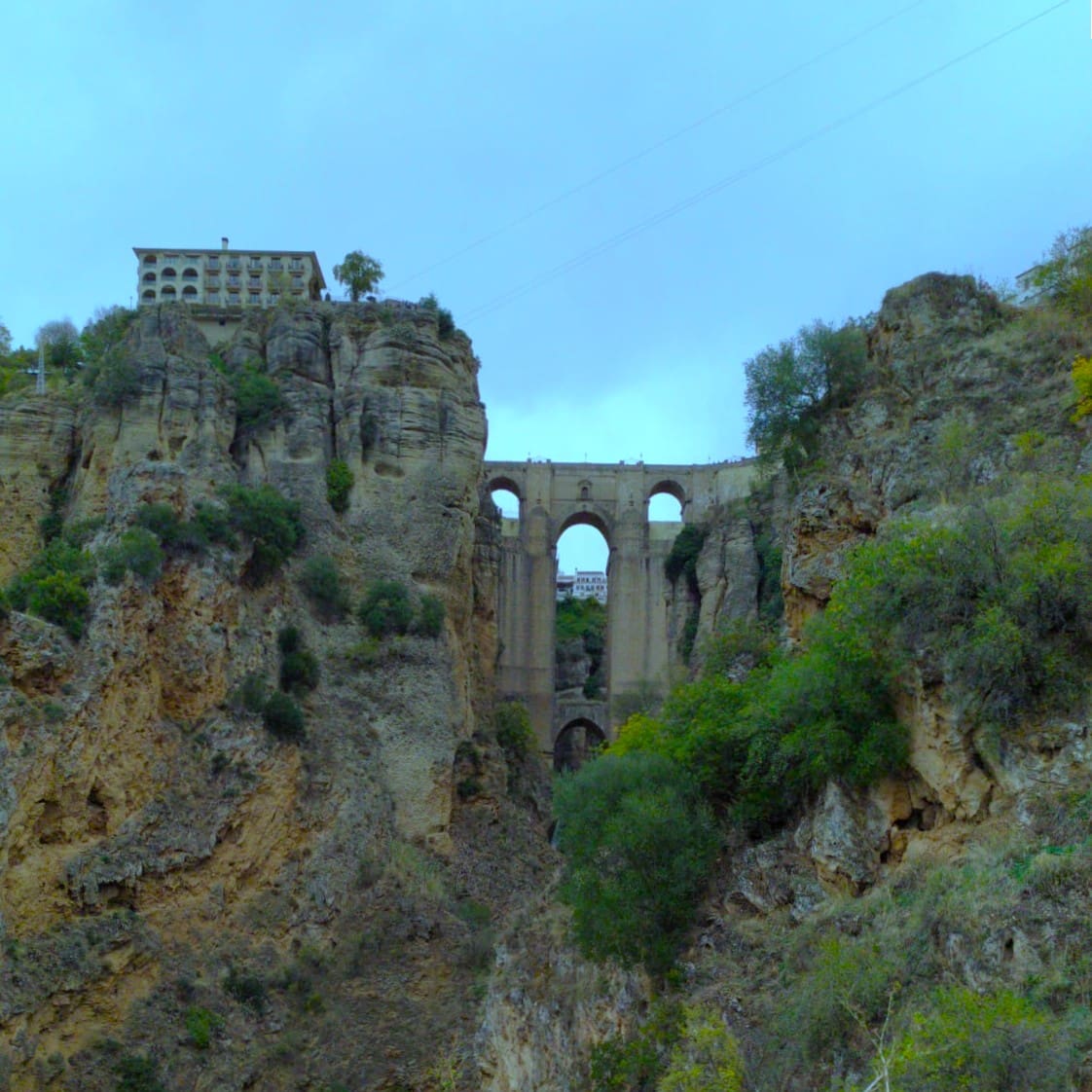 Puente Nuevo bridge spanning the El Tajo gorge in Ronda, seen from below on a day trip from Seville