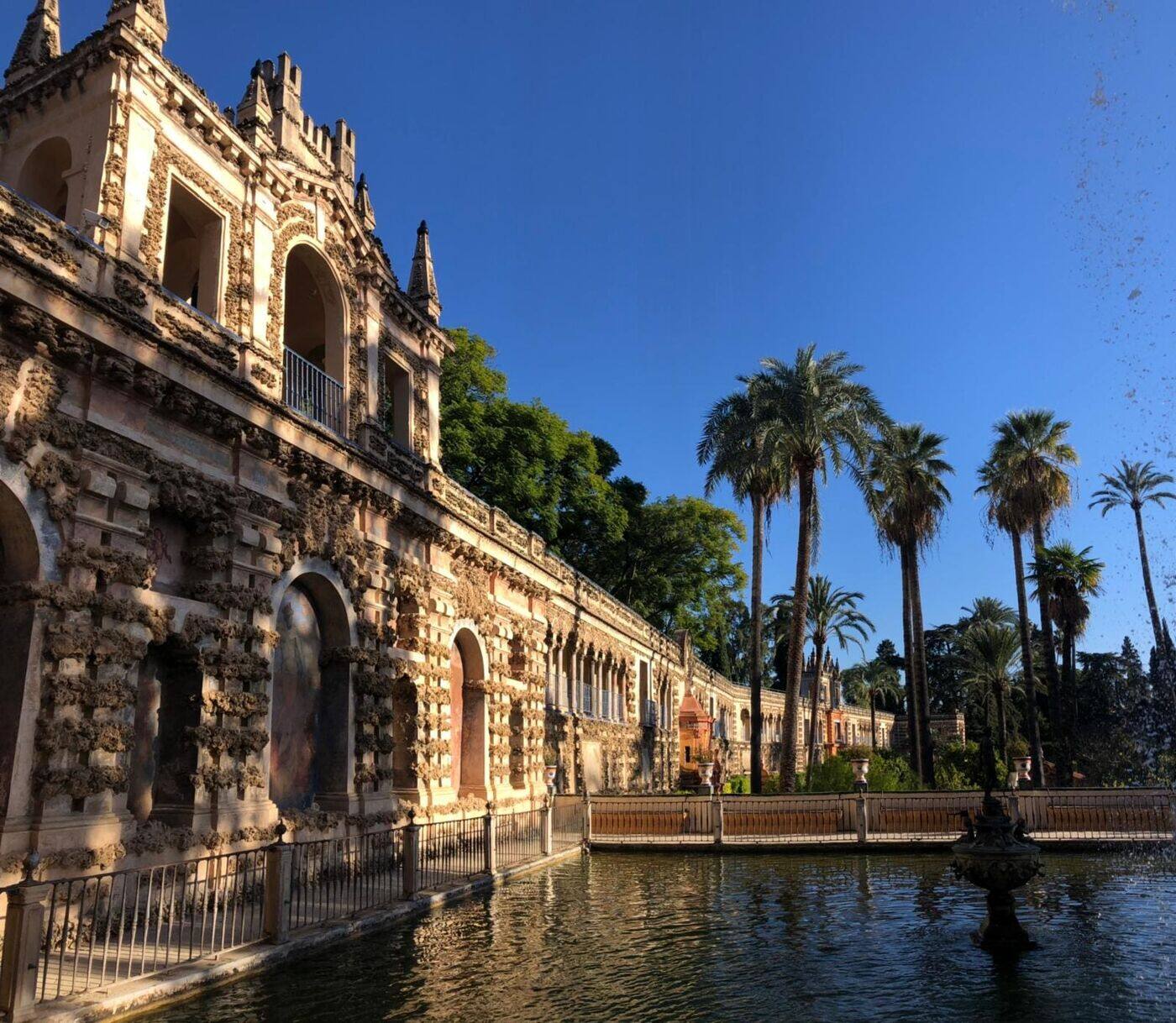 Mercury Pond and the Grutesco gallery in the Royal Alcázar gardens, one of the attractions Seville is famous for