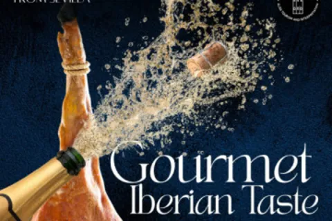 A leg of Iberian ham with a bottle of sparkling wine — gourmet Iberian tasting experience from Seville
